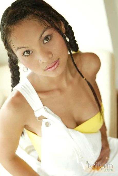 Thai girl Tailynn in pigtails shows off her asset