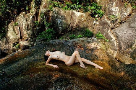 Asian teen amateur girl strips and shows her hairy pussy in the backyard