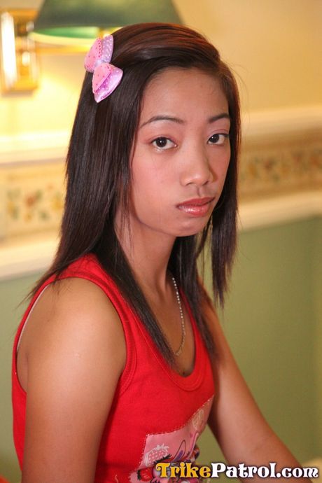 Asian teen Lalaine shows her hairy pussy and small tits in a solo