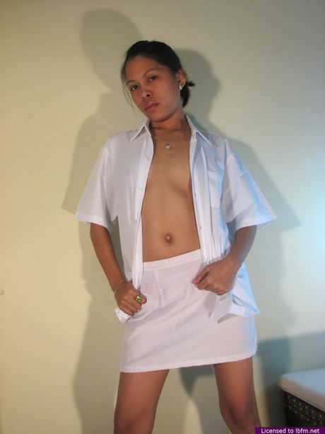 Skinny Asian amateur chick strips off and reveals her tiny tits and ass