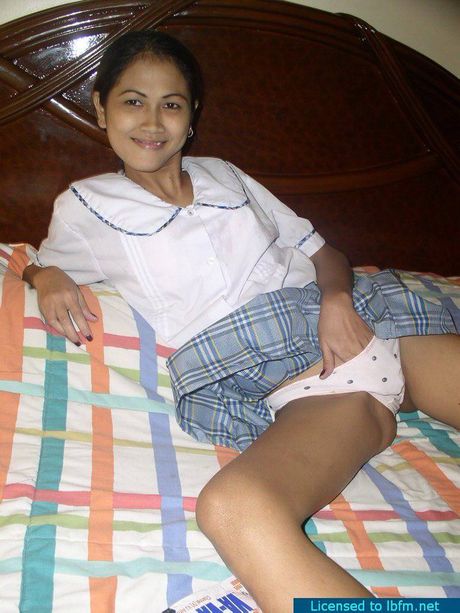 Skinny Asian schoolgirl strips and shows her tiny tits and pussy up close