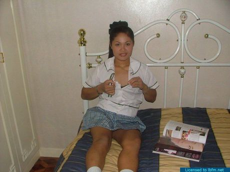 Japanese teenage amateur strips off and bares her tiny tits and pussy