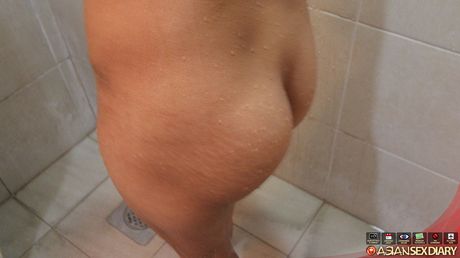 Asian teen Vincenikki strips and shows her hairy cunt and ass in the shower