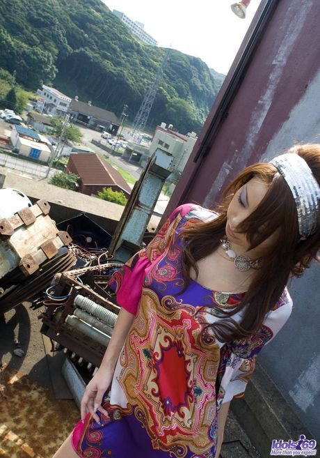 Platinum Asian babe Risa Kasumi strips and shows her amazing boobs and ass