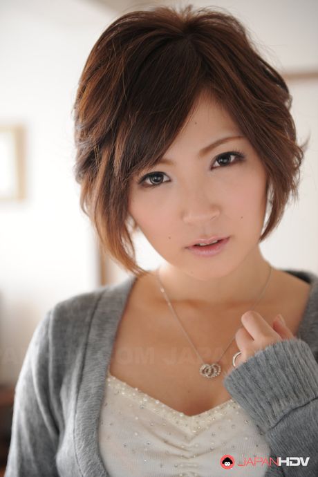 Asian Kaede Oshiro with busy mouth shows sexy legs in hot photos.