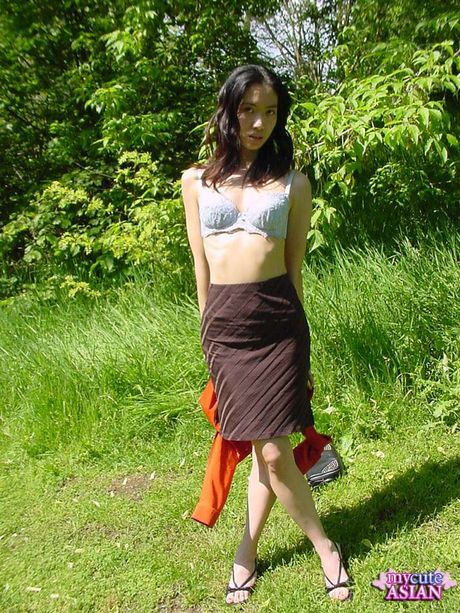 Platinum Japanese teen strips and shows her tiny tits and pussy