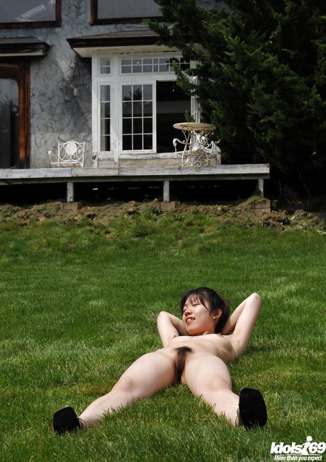 Curious japanese Youzn denudes small tits and hot butt outside