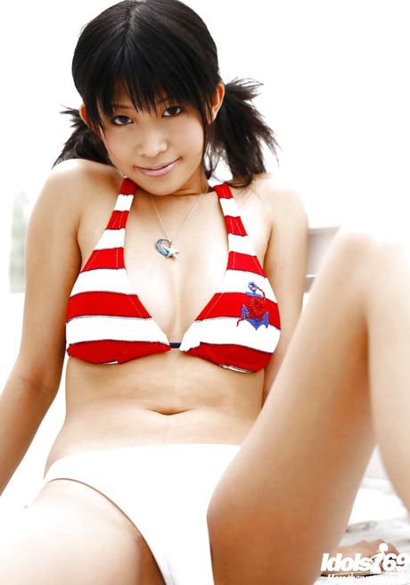 Luscious japanese young Sasa Handa in bikini exposing big hooters and sexy butt